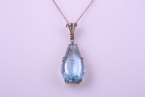 Silver Art Deco Pendant With A Blue Stone