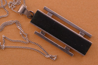 Silver Retro Pendant With A Black Stone