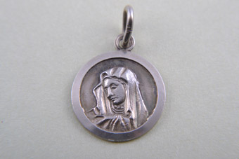 Silver Charm With Religious Figure