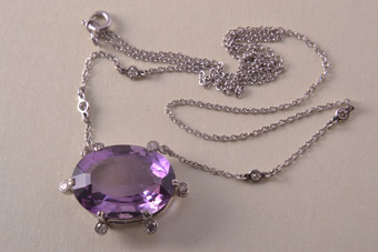 Gold Necklace With An Amethyst And 10 Diamonds