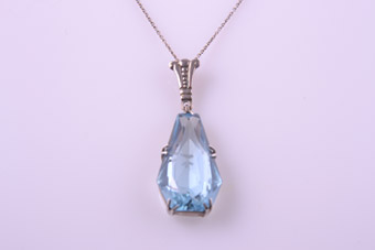 Silver Art Deco Pendant With A Blue Stone